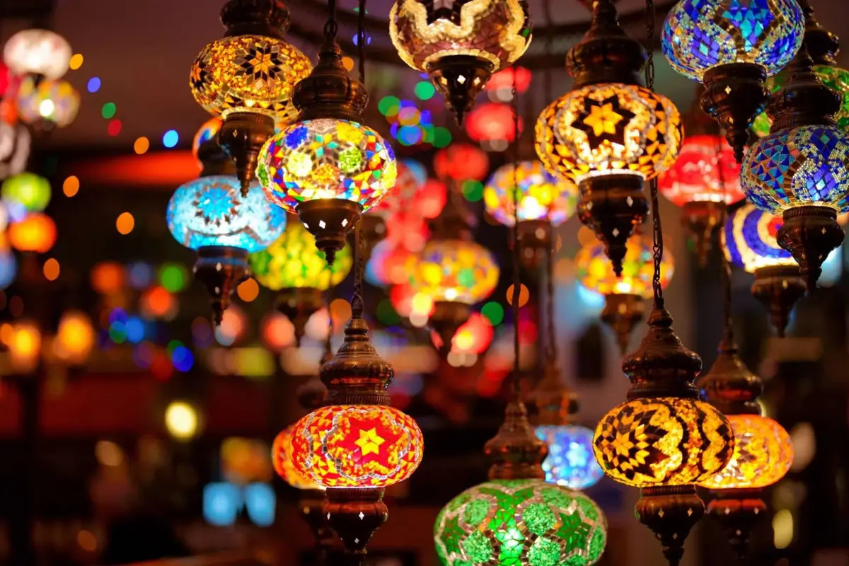 Colourful Turkish mosaic lamps glowing in the dining room at Bistro 1